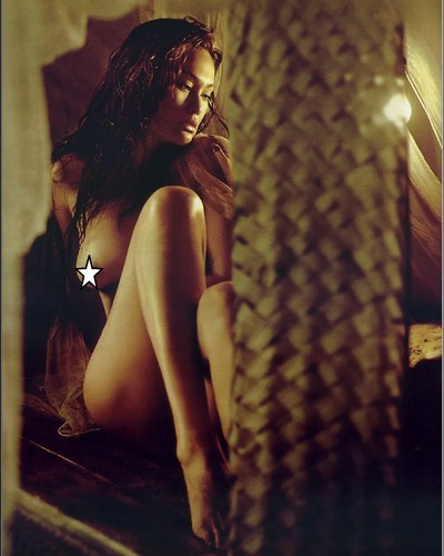 Tia carrere posing without - tia,